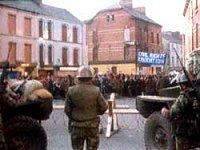 Image of civil rights march halted at an army barricade