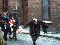 Image of Fr Edward Daly preceeding a group carrying the body of 17 year-old Jack Duddy
