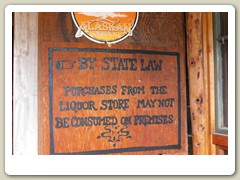 Warning by the liquor store window