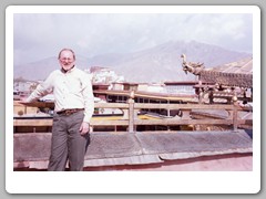 John on the roof with the Potala Palace in the background