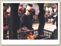 Kirsten lighting incense at the temple