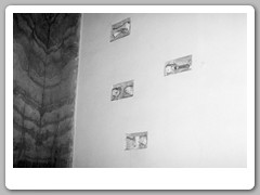 Early earthquake detection - pieces of glass between 2 bars on the wall